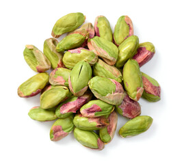 peeled pistachios isolated on the white background, top view