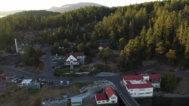 Cinematic 4K aerial drone dolly out shot of Orcas Village, Orcas Island Ferry Terminal off of Harney Channel in the San Juan Islands in Washington