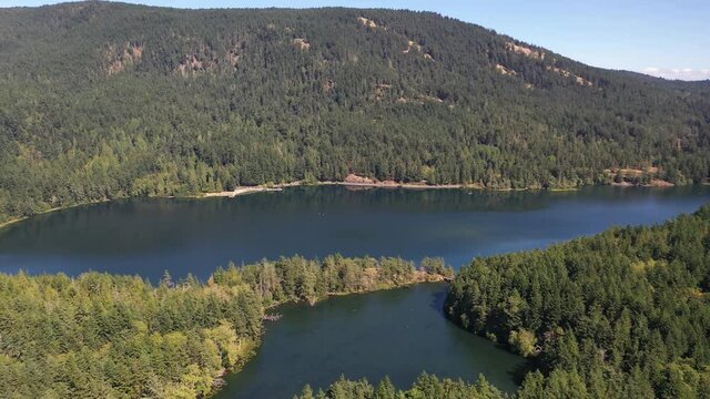 Cinematic 4K aerial drone pan footage of Cascade Lake and Moran State Park on Orcas Island in Washington