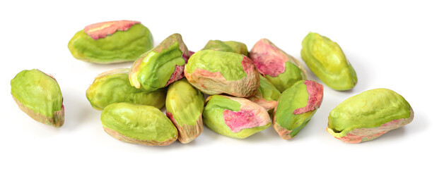 peeled pistachios isolated on the white background