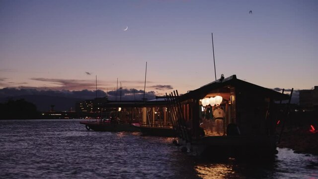 Peaceful summer evening on the Nagara River, Gifu Japan. Moon over Ukai Boats