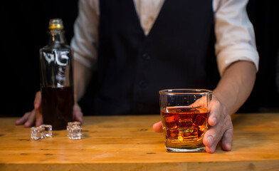Bartender Serve Whiskey, on wood bar, 
