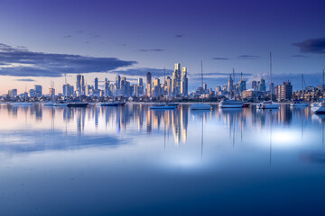Melbourne, Victoria, Australia - August 2021: Melbourne city skyline at dusk, from the Royal Melbourne Yacht Squadron marina on Port Phillip Bay in St Kilda.
