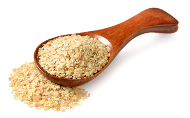 uncooked wheat germ in the wooden spoon, isolated on the white background
