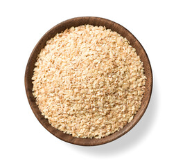 uncooked wheat germ in the wooden bowl, isolated on the white background, top view
