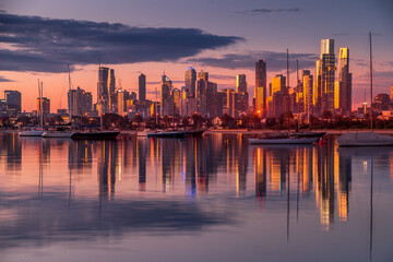 Fototapeta na wymiar Melbourne, Victoria, Australia - August 2021: Melbourne city skyline at dusk, from the Royal Melbourne Yacht Squadron marina on Port Phillip Bay in St Kilda.