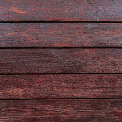 Brown wooden background made of boards with raindrops on the surface