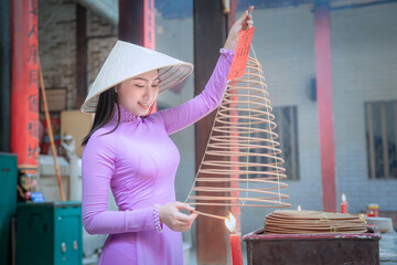Young Vietnam woman wearing Ao Dai culture traditional at old temple at Ho Chi Minh in Vietnam,vintage style,travel and relaxing concept. - 458659190