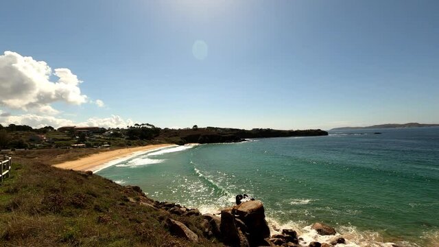 Traveling from La lanzada beach in Galicia spain, walking along the fence and entering through it.