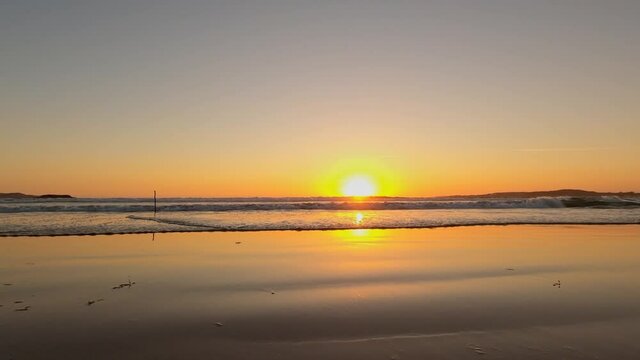 Traveling sideways from the beach of La lanzada in Galicia Spain during sunset at the seaside