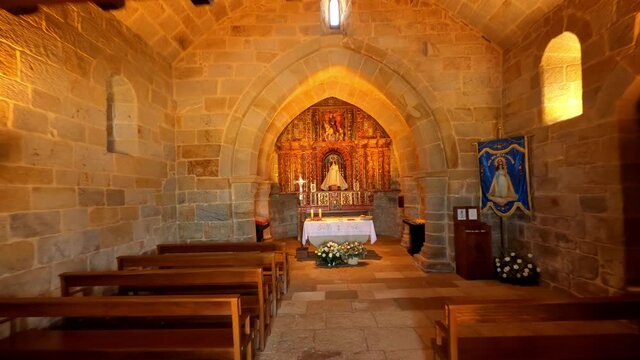 Traveling inside the Romanesque chapel of La lanzada beach in Galicia, Spain.