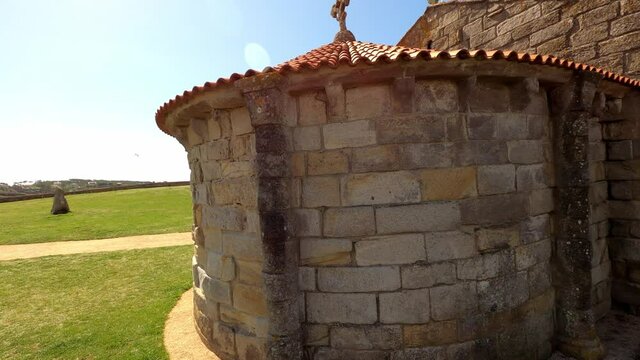 Traveling around the Romanesque chapel of La lanzada beach in Galicia Spain, on a sunny day.