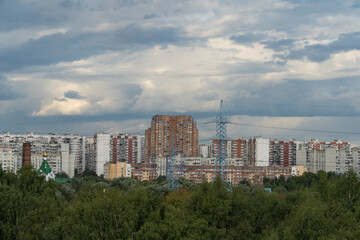 City landscape against the backdrop of a stormy sky.