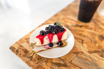 Blueberry cake on a plate in a cafe