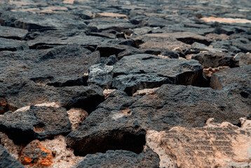 Dark stones and bricks of old wall in castle. Poland, Lower Silesia