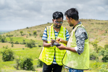 Trainer teaching by explaining about drone operations to student - Concept drone or UAV pilot training.