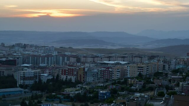 Siirt city in Turkey day to night timelapse with a view to the whole city during sunset.