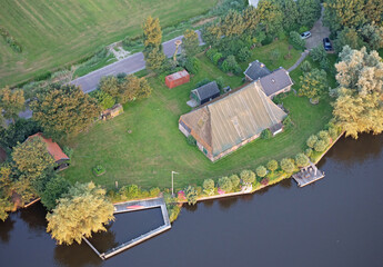 Naklejka premium Agricultural landscape of Friesland, one of the northern provinces of the Netherlands - Friesland from above - Local farm