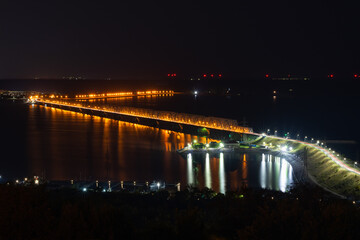 Fototapeta na wymiar The Bridge in night time. The street in night time. The Imperial Bridge in Ulyanovsk, the fifth longest in Russia.