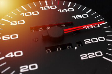 Car speedometer. Auto car speedometer shows 180 km h or miles.Closeup shot,dark black...