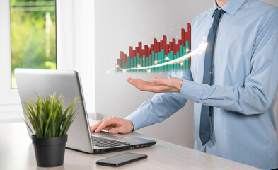 Businessman hold drawing on screen growing graph, arrow of positive growth icon.pointing at creative business chart with upward arrows.Financial, business growth concept.