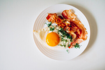 scrambled eggs with bacon and herbs for breakfast