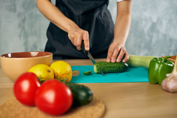 Woman in black apron Cooking healthy eating cutting board