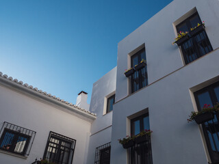 Fototapeta na wymiar Modern white building with blue sky, horizontal photography