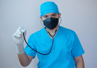 portrait of male doctor holding stethoscope