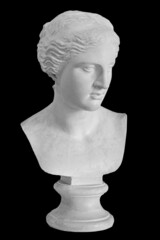 Gypsum copy of ancient statue Venus head isolated on black background. Plaster sculpture woman face