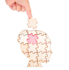 Completing a woman's head shaped jigsaw puzzle