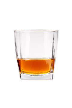 Shot of glass is half full of whiskey. Glasses are isolated on the white background.