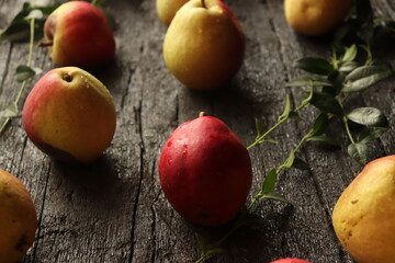 sweet and fragrant autumn pears on rustic black wooden table