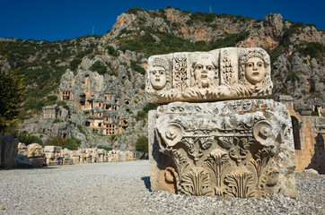 Ruins of ancient city of Myra in Demre, Turkey. Theatrical masks relief and ancient rock tombs in...