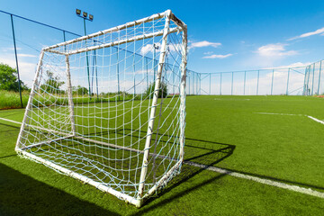 Amateur soccer field with goal, back view