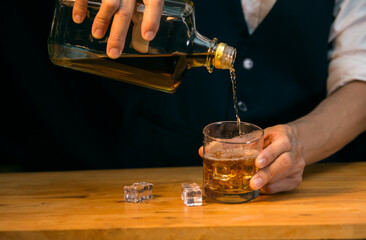Barman pouring whiskey whiskey glass beautiful night