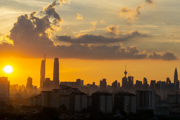 Fototapeta na wymiar KUALA LUMPUR, MALAYSIA - 21st SEP 2021; Majestic and golden sunset over downtown Kuala Lumpur, a capital of Malaysia. 
