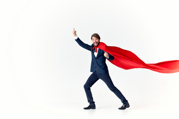 man wearing red cape superman jump