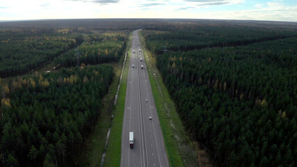 Aerial shot of traffic with trucks and cars on modern road