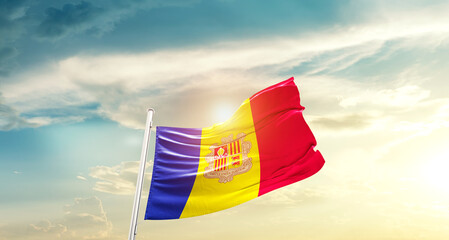 Andorra national flag cloth fabric waving on beautiful sky - Image