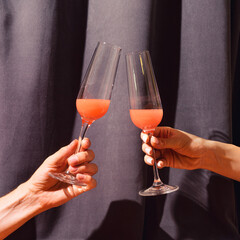 Party celebrity concept. Two hands, man one holding unique glas and gilr hand holding posh crystal...