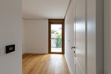 Interior of an empty apartment with wooden parquet