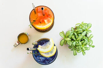 Colorful drink or beverage, top view. Blue cocktail with lemon slices and watermelon juice