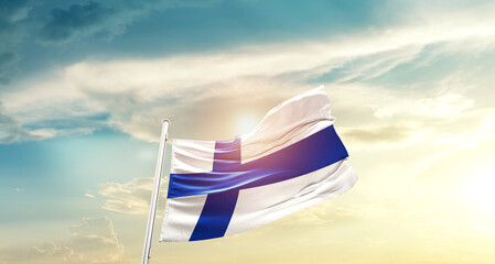 Finland national flag cloth fabric waving on beautiful sky - Image