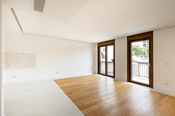 Interior of an empty apartment with wooden parquet
