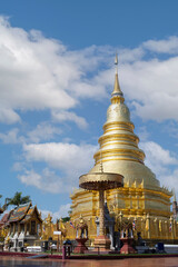 Fototapeta premium A golden pagoda at Wat Phra That Hariphunchai in Lumphun Province, Thailand .
