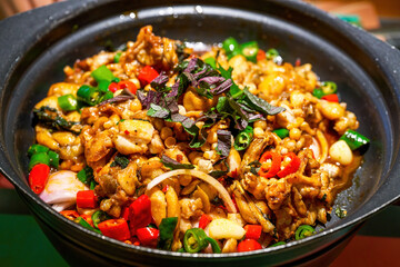 A pot of delicious green pepper and basil dry pot bullfrog