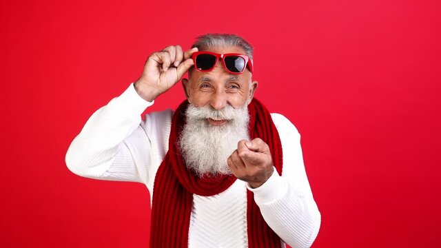 Annoyed arrogant santa grandpa take off sunglass argue show middle finger