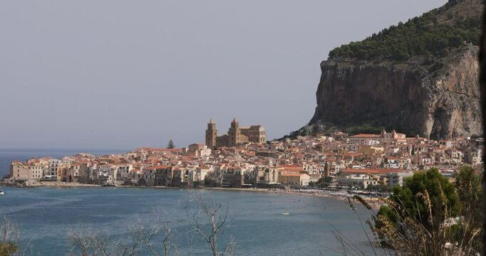 Slight zoom in on the town of Cefalù, Palermo, Sicily, with its Cathedral on the Tyrrhenian Sea