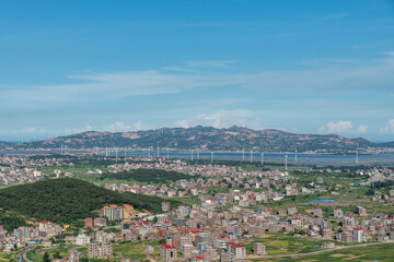 The mountain overlooks the rich villages and towns